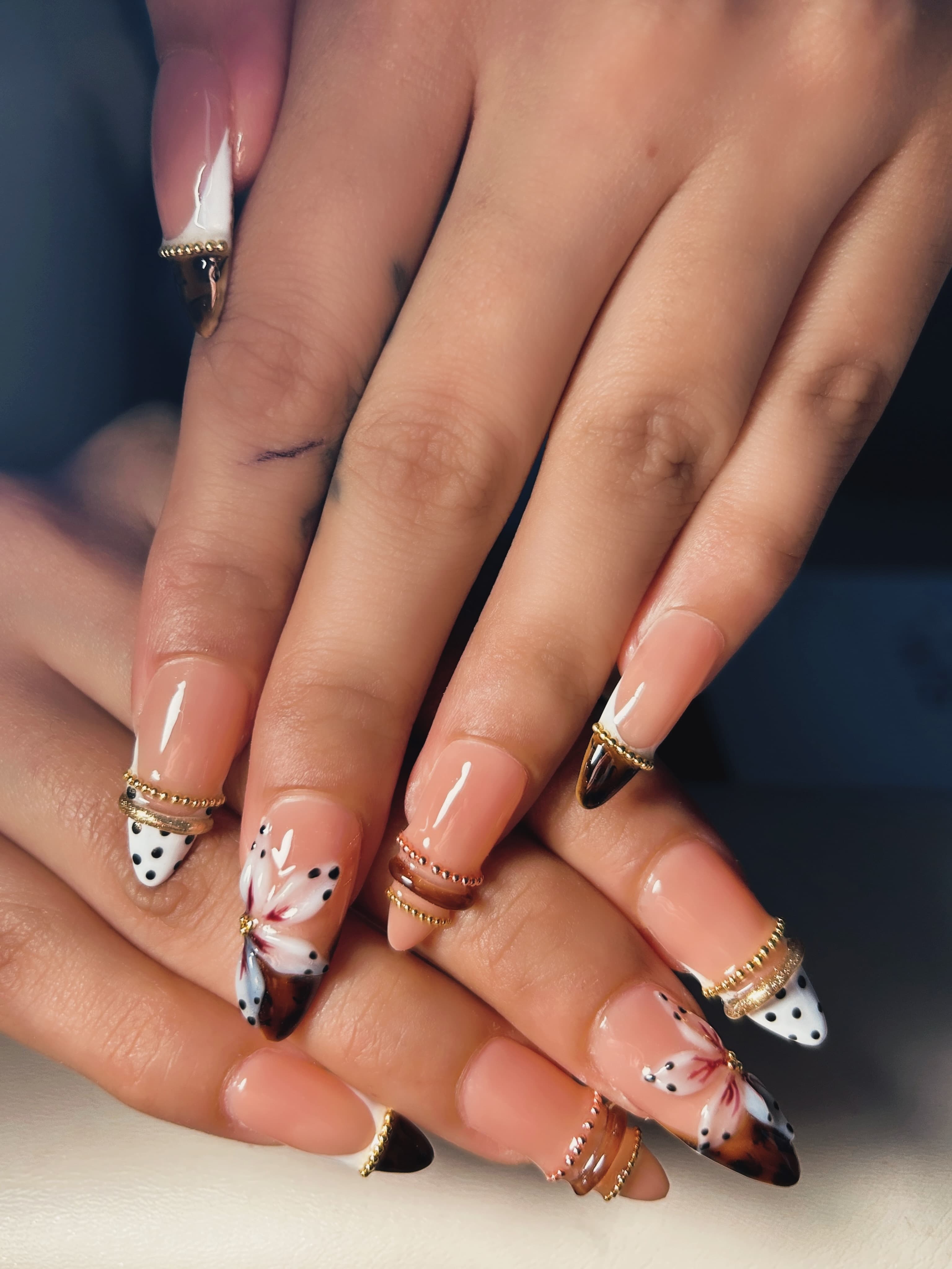 GiGi Nails Vantaa — gold details, flower accents, and flawless french tips